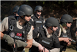SWAT Members Prepared With Handguns