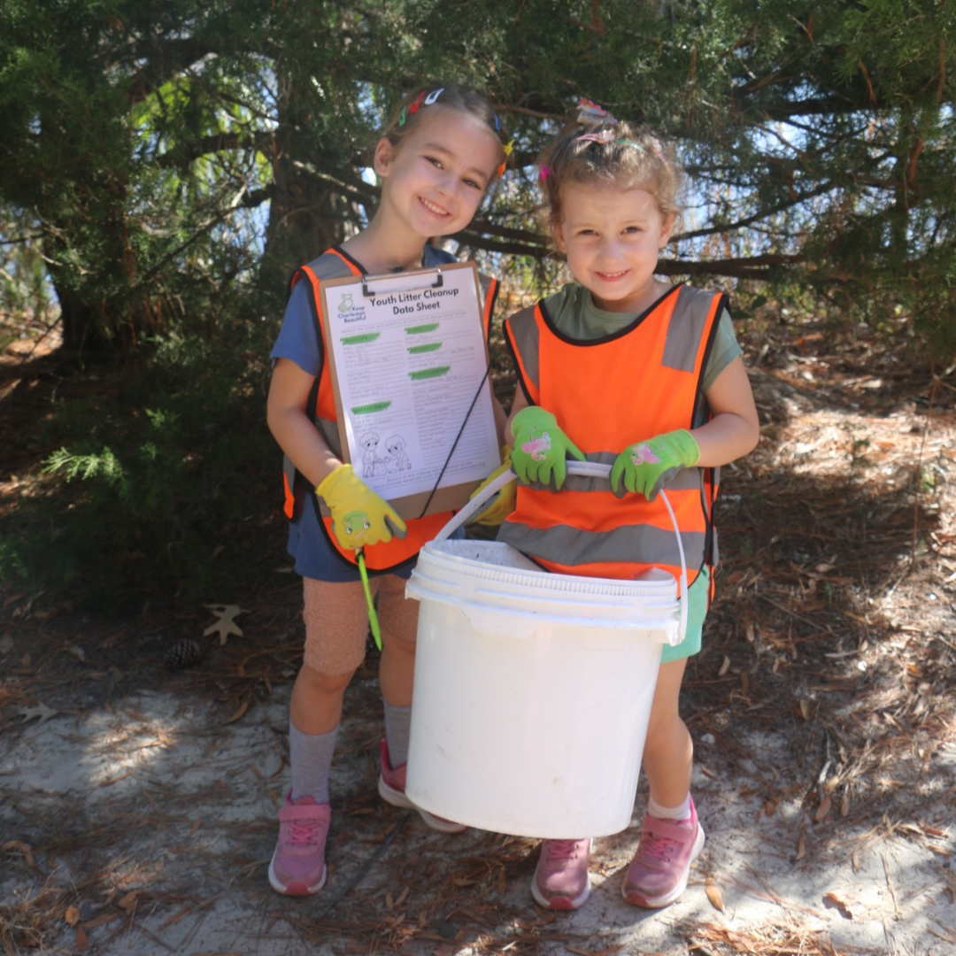 Youth Volunteer with Litter Sheet and Trash